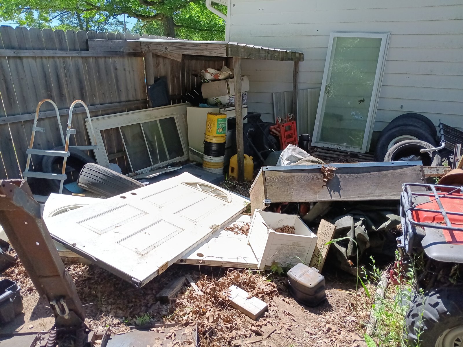 *What we do* Before yard garbage clean up close up on construction waste material